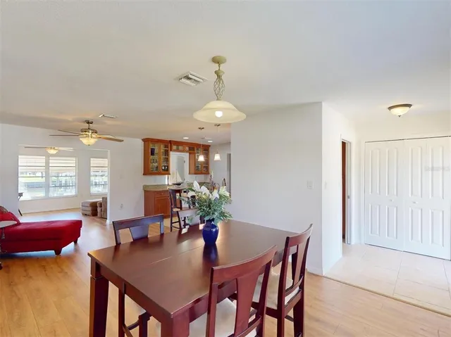 a kitchen with sink a stove and cabinets