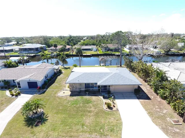 a view of a swimming pool and mountains in the background