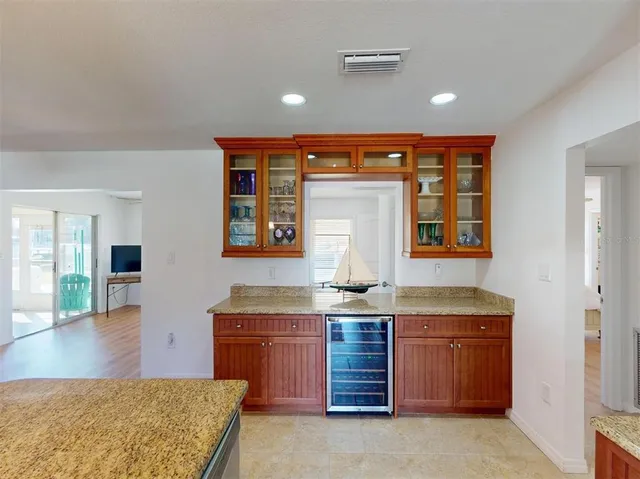 a bathroom with a double vanity sink and mirror with toilet