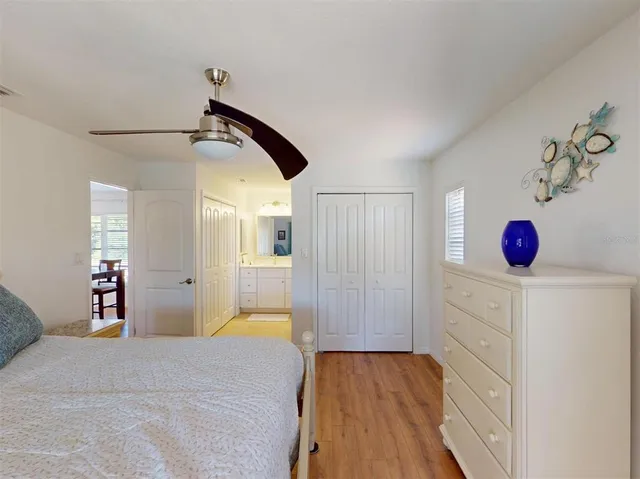 a bed room with a bed and a television