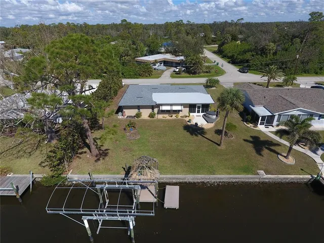 an aerial view of a house with a swimming pool