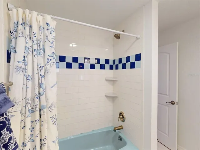 a view of a lake with a table and chairs