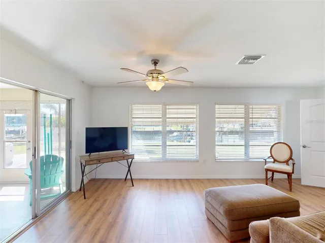 a view of a house with swimming pool next to a yard