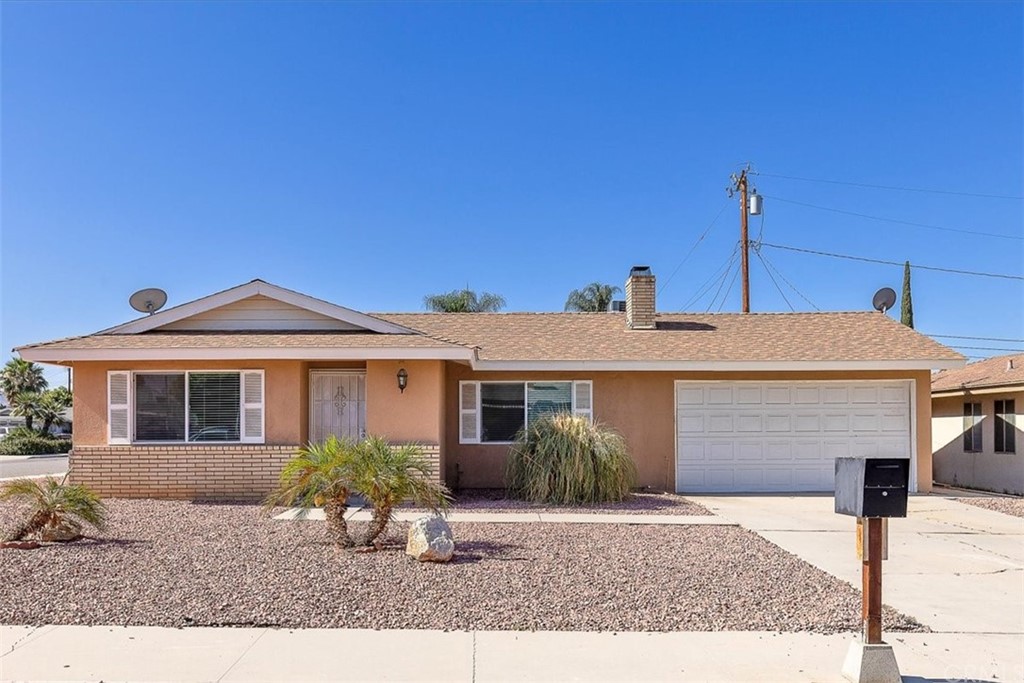 515 Opal Avenue Hemet, CA 92543 - Photo 1 of 1 a front view of a house with garden