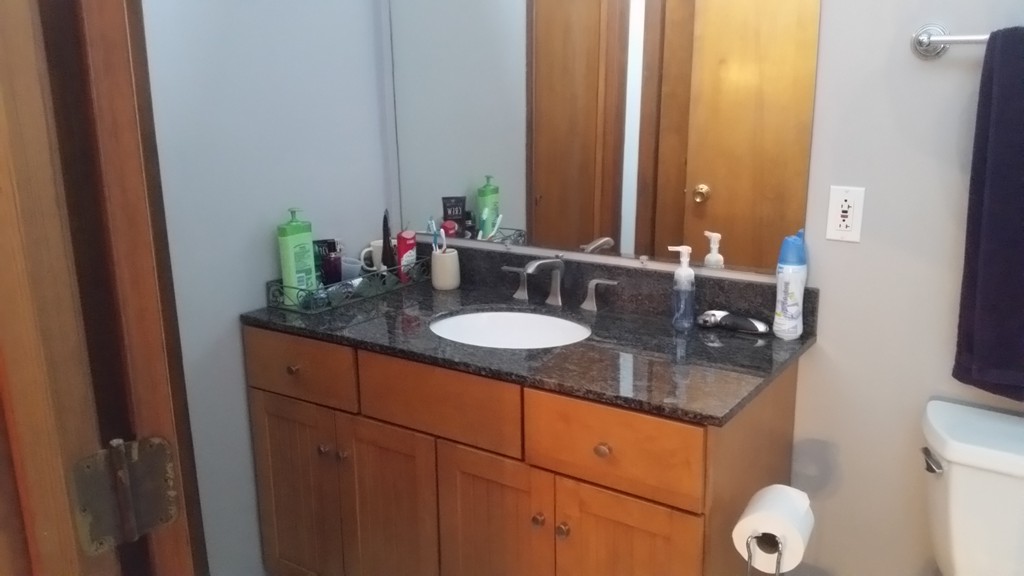 10 Ramshorn Road Sutton, MA 01590 - Photo 23 of 24 a bathroom with a granite countertop sink and a mirror