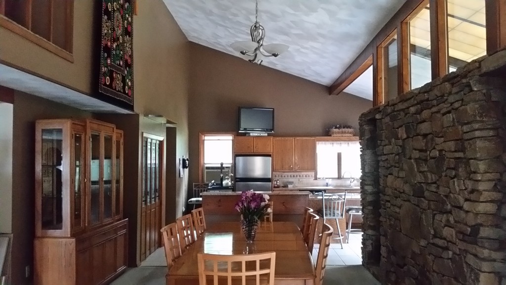 10 Ramshorn Road Sutton, MA 01590 - Photo 3 of 24 a kitchen with stainless steel appliances kitchen island granite countertop a refrigerator a stove and a microwave oven with wooden floor