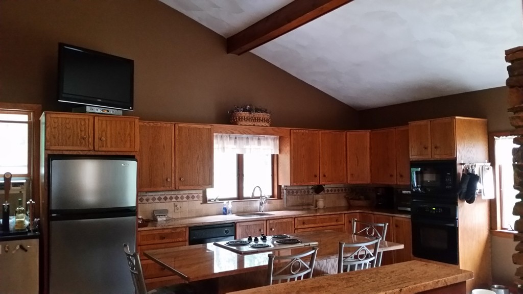 10 Ramshorn Road Sutton, MA 01590 - Photo 4 of 24 a living room with fireplace furniture and a flat screen tv
