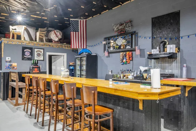 a view of a swimming pool with seating space