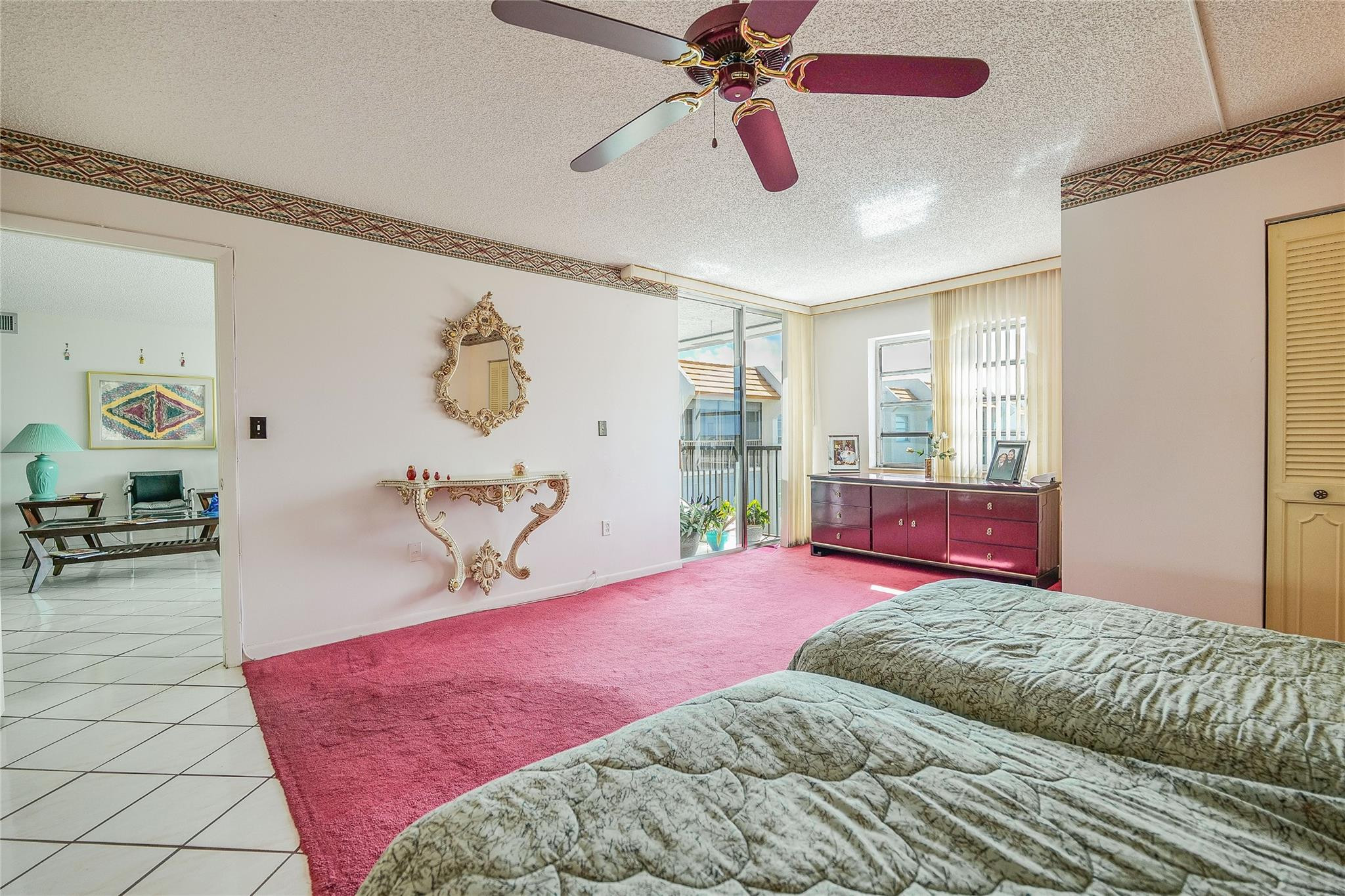 3910 Inverrary Boulevard, Unit 805B Lauderhill, FL 33319 - Photo 15 of 51 a bedroom with a bed and wooden floor