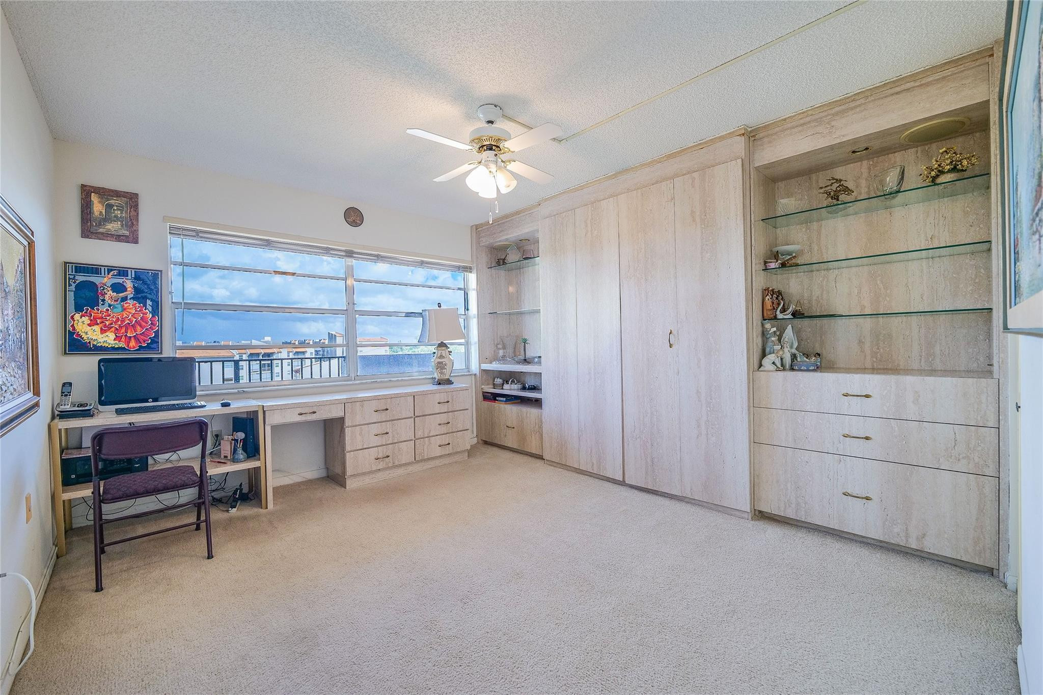 3910 Inverrary Boulevard, Unit 805B Lauderhill, FL 33319 - Photo 19 of 51 a open kitchen with cabinets and window