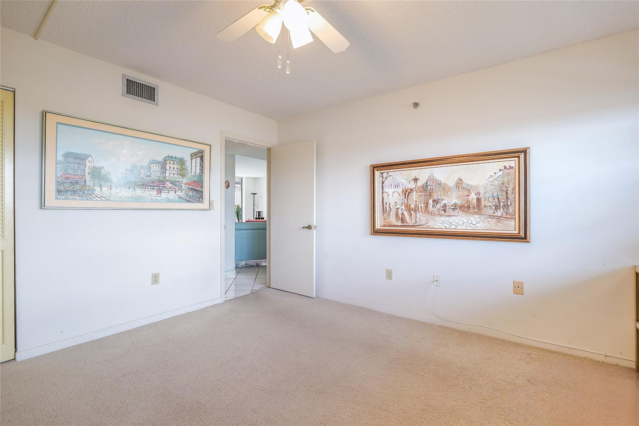 3910 Inverrary Boulevard, Unit 805B Lauderhill, FL 33319 - Photo 20 of 51 a view of an empty room with painting on the wall