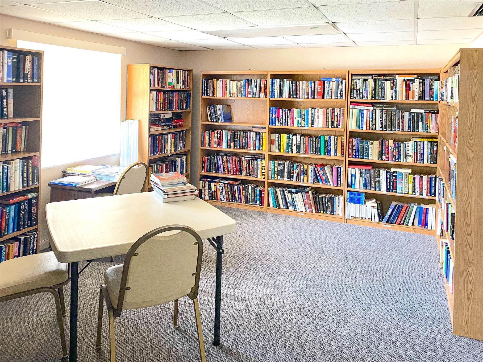 3910 Inverrary Boulevard, Unit 805B Lauderhill, FL 33319 - Photo 35 of 51 a view of a workspace with furniture and a bookshelf