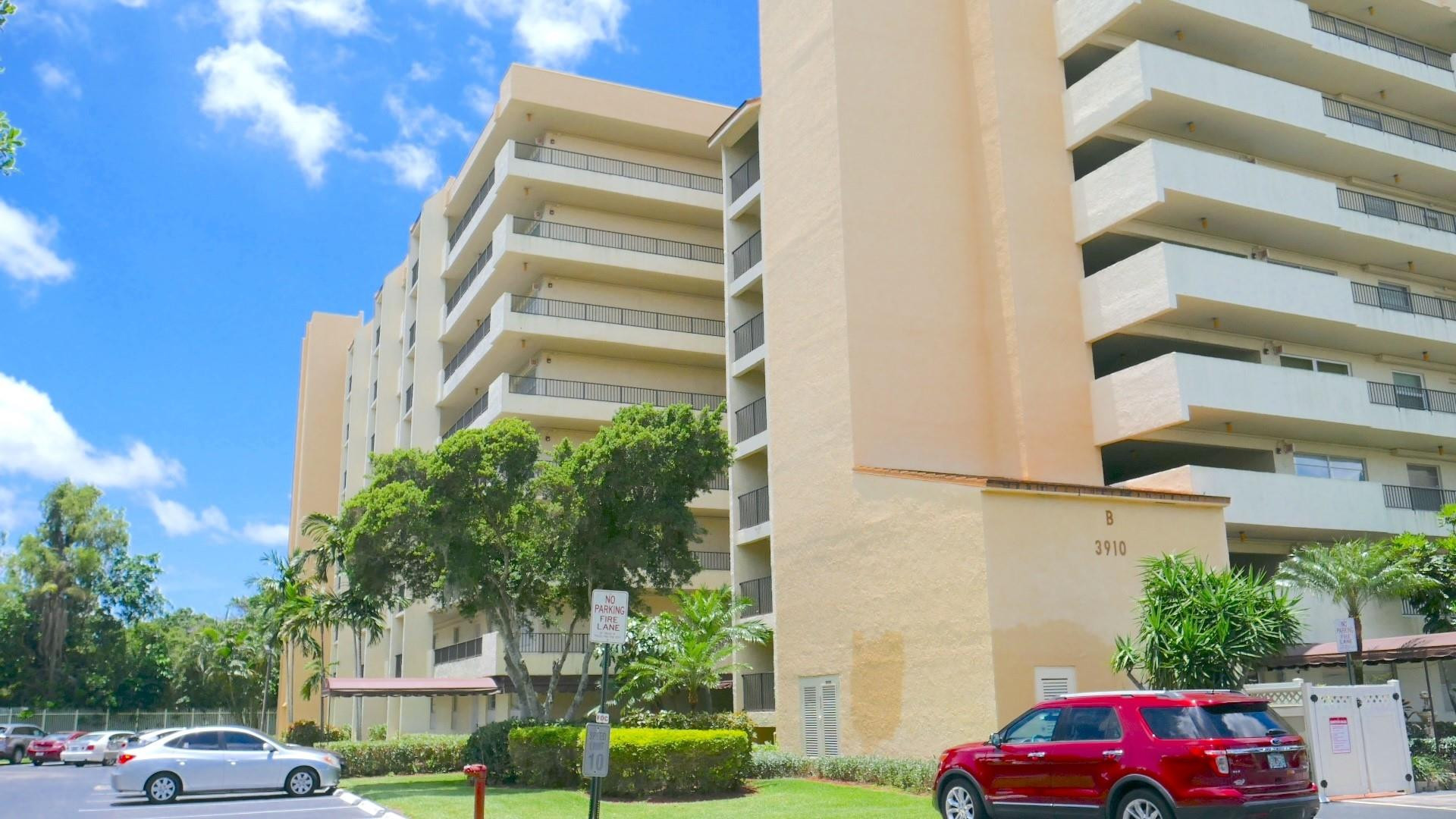 3910 Inverrary Boulevard, Unit 805B Lauderhill, FL 33319 - Photo 41 of 51 a front view of a building with cars parked