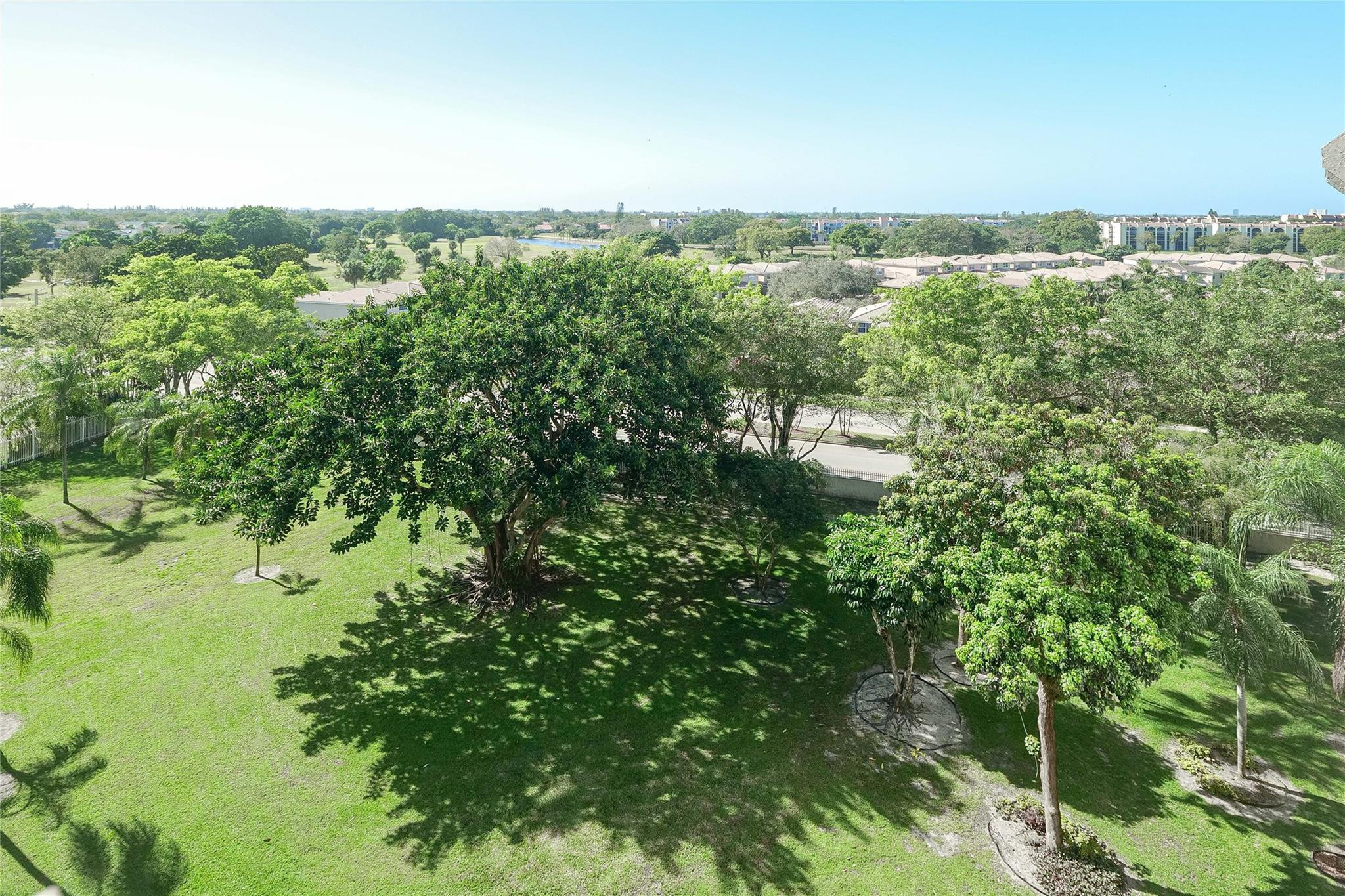 3910 Inverrary Boulevard, Unit 805B Lauderhill, FL 33319 - Photo 50 of 51 a view of a lake and green valley