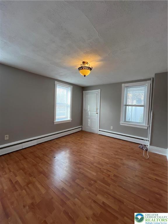 2280 Main Street, Unit 3 Bethlehem, PA 18017 - Photo 5 of 16 wooden floor in an empty room with a window