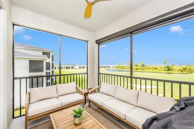 a bedroom with furniture and a flat screen tv