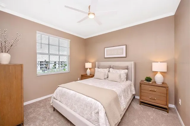 a bedroom with a bed and a painting on the wall