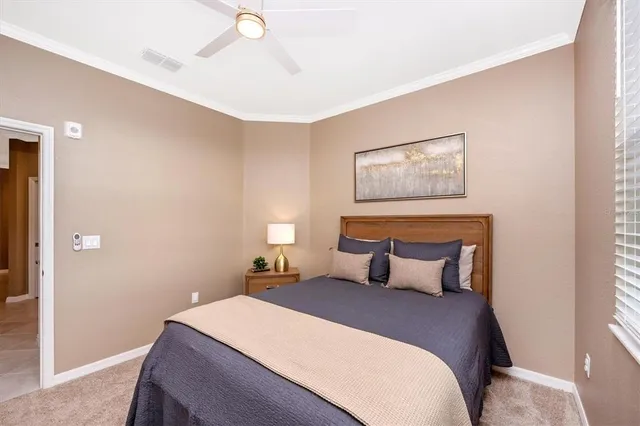 a swimming pool view with a seating space and a garden view