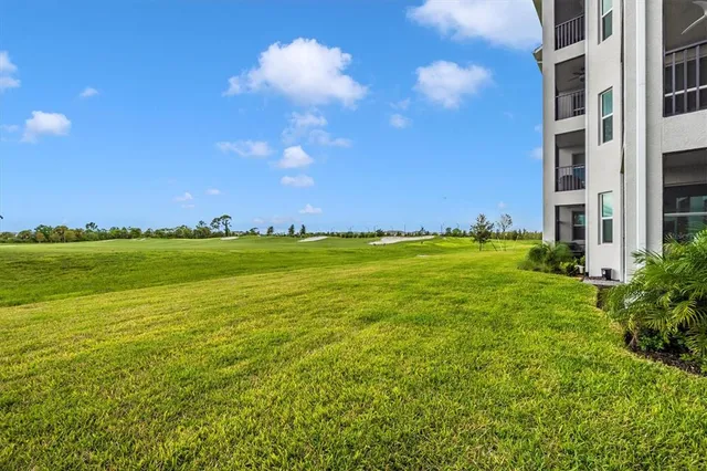 a swimming pool with trees in the background