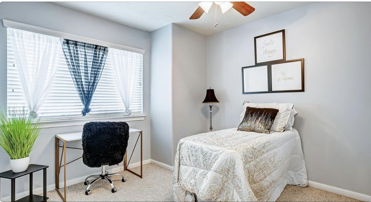 18927 Crescent Fountain Road Spring, TX 77388 - Photo 11 of 13 a bedroom with a bed and a chair