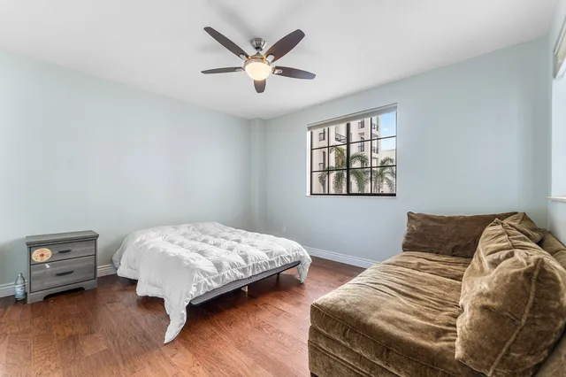 a bedroom with two beds and a window