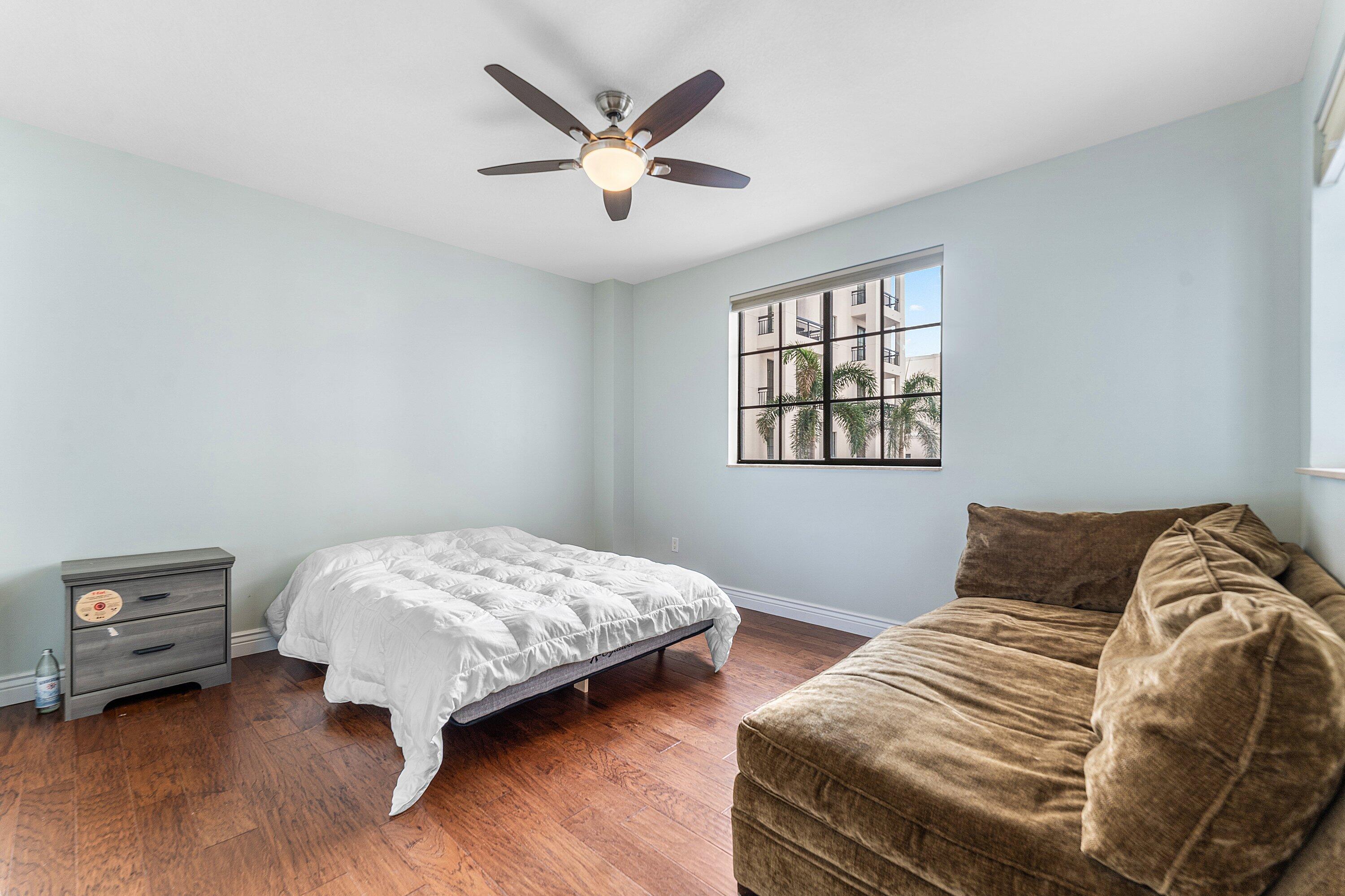 233 South Federal Highway, Unit 308 Boca Raton, FL 33432 - Photo 11 of 44 a bedroom with two beds and a window