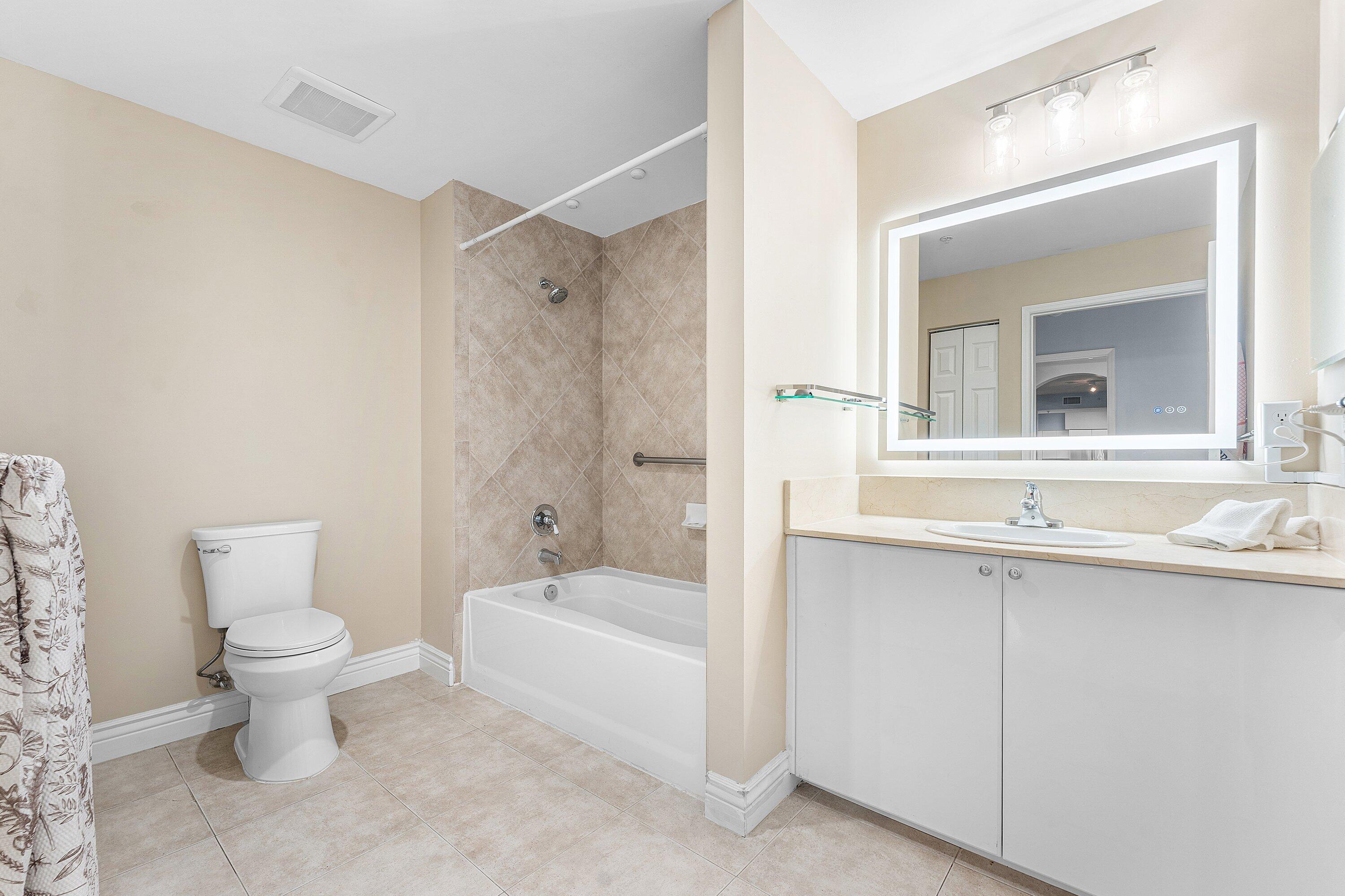 233 South Federal Highway, Unit 308 Boca Raton, FL 33432 - Photo 13 of 44 a bathroom with a sink toilet and shower