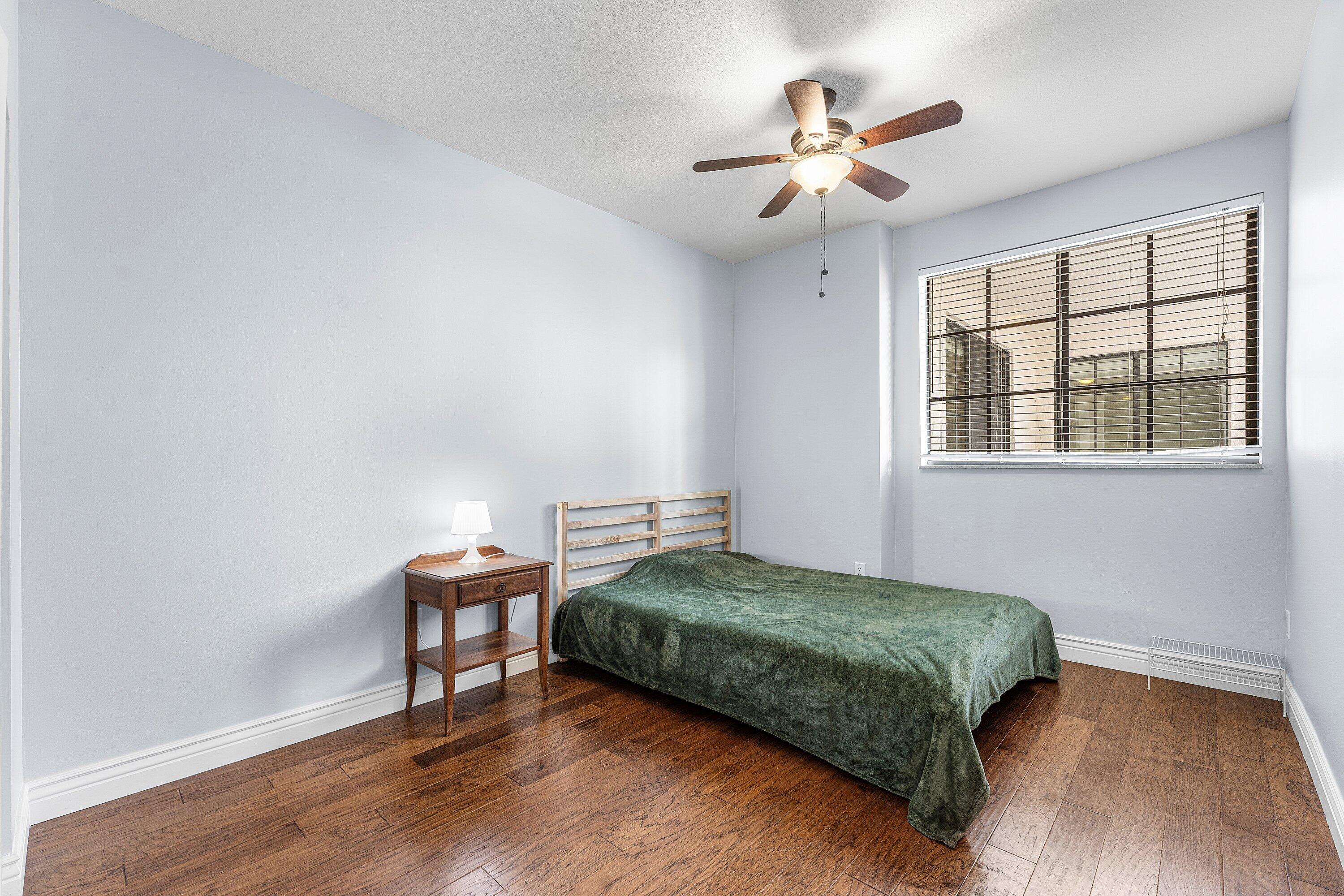 233 South Federal Highway, Unit 308 Boca Raton, FL 33432 - Photo 15 of 44 a bedroom with a bed and a table in it