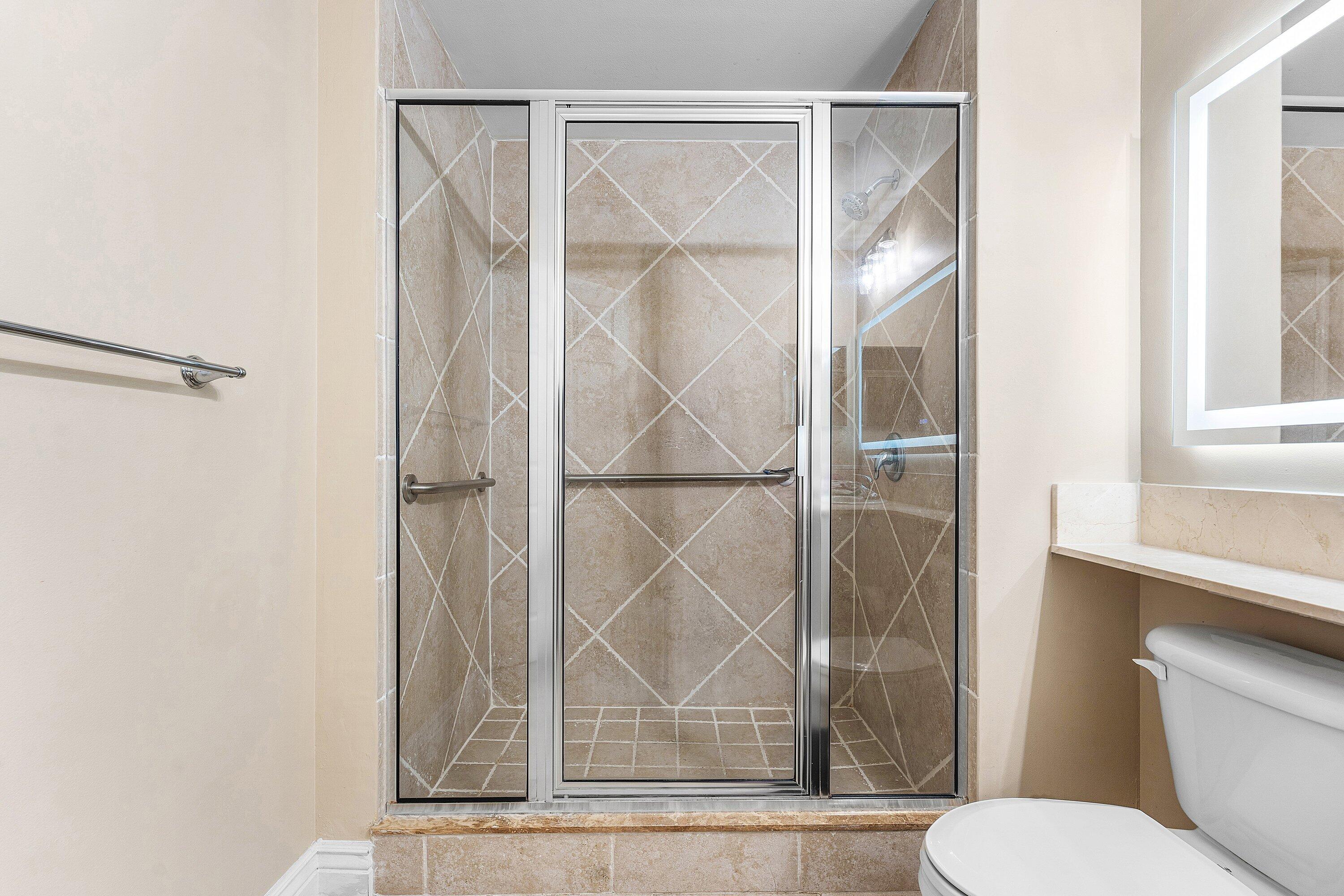 233 South Federal Highway, Unit 308 Boca Raton, FL 33432 - Photo 17 of 44 a bathroom with a toilet and a shower