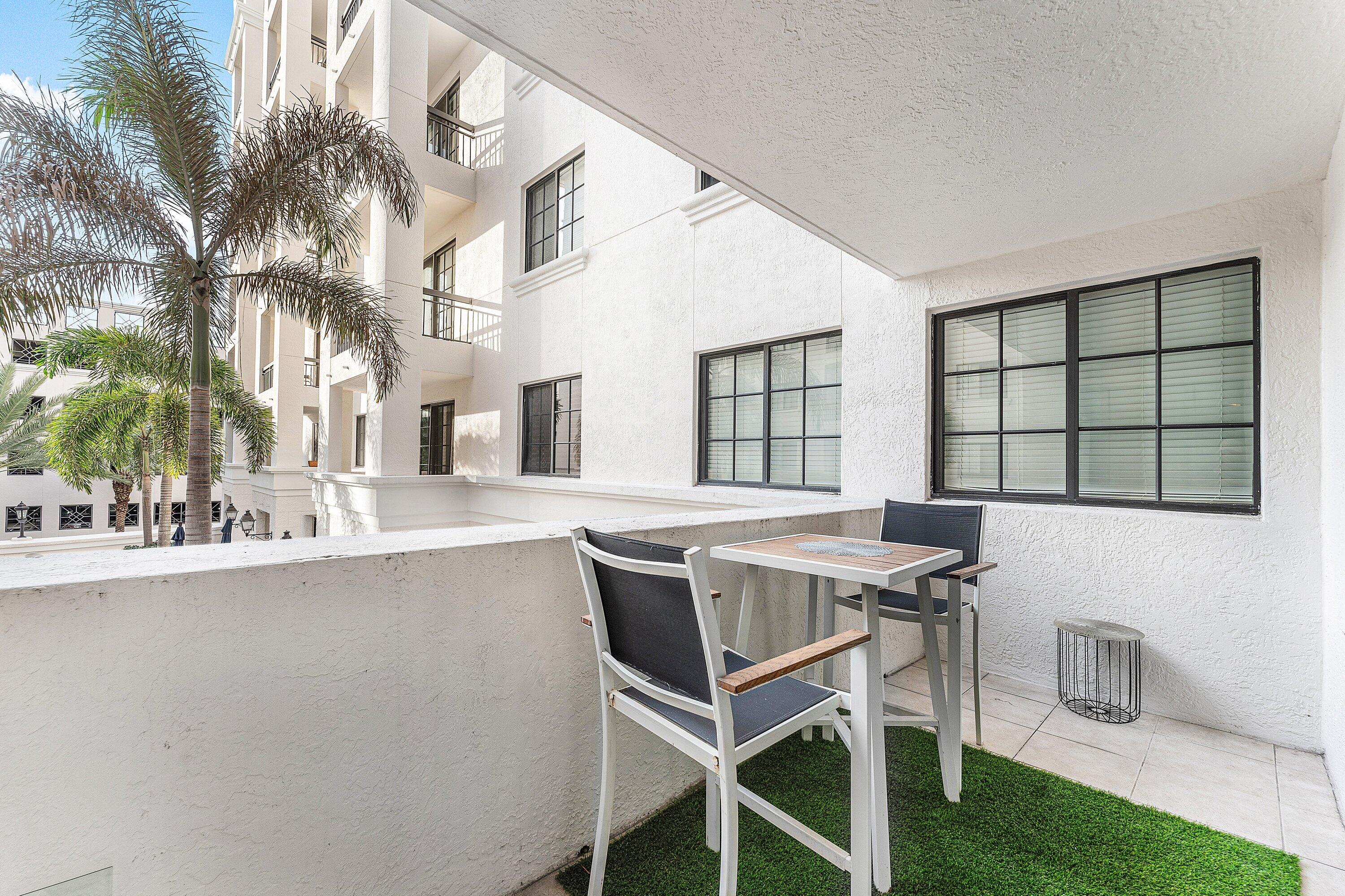 233 South Federal Highway, Unit 308 Boca Raton, FL 33432 - Photo 20 of 44 a dining room with a table and chairs