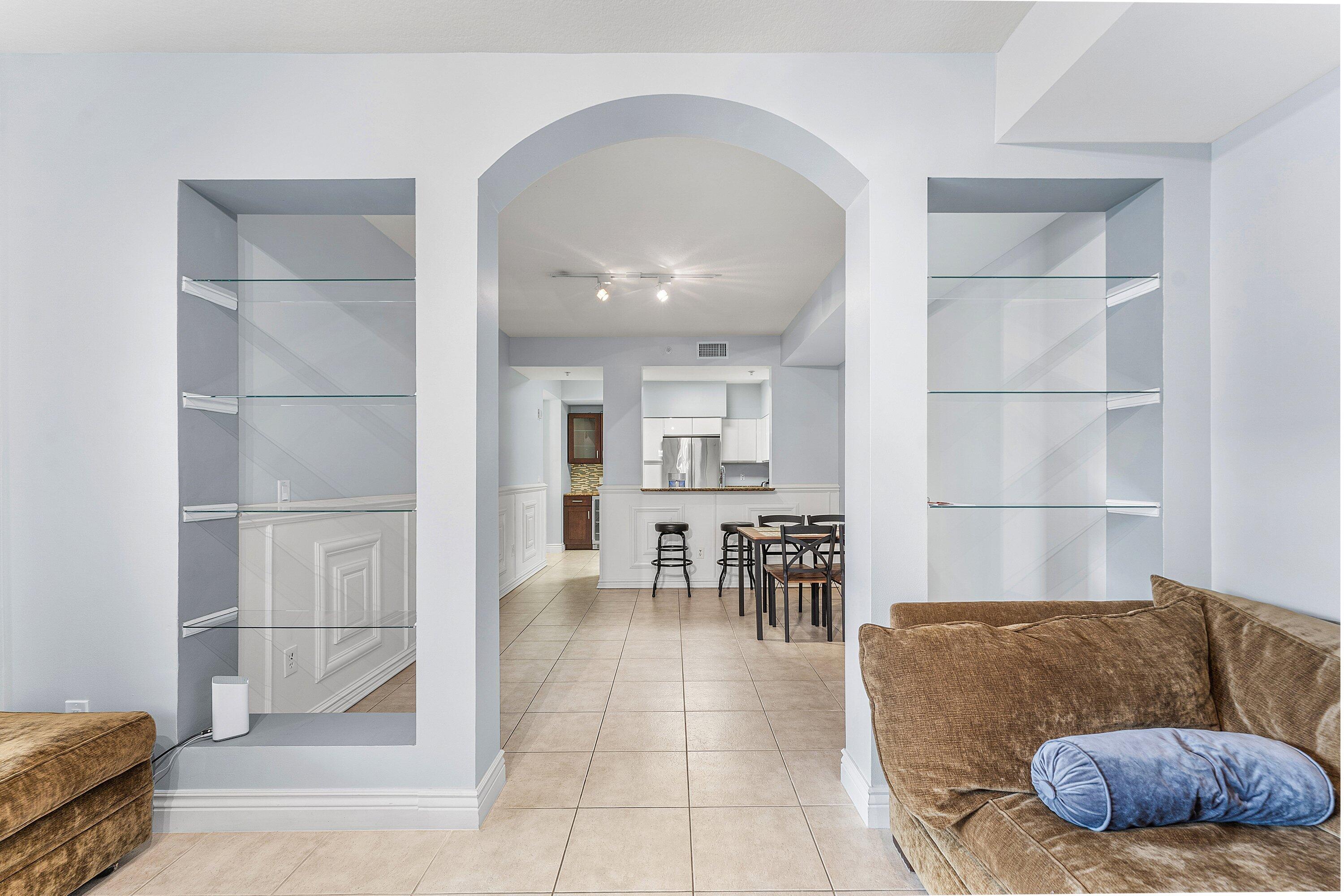 233 South Federal Highway, Unit 308 Boca Raton, FL 33432 - Photo 3 of 44 a living room with furniture and a dining table with kitchen view