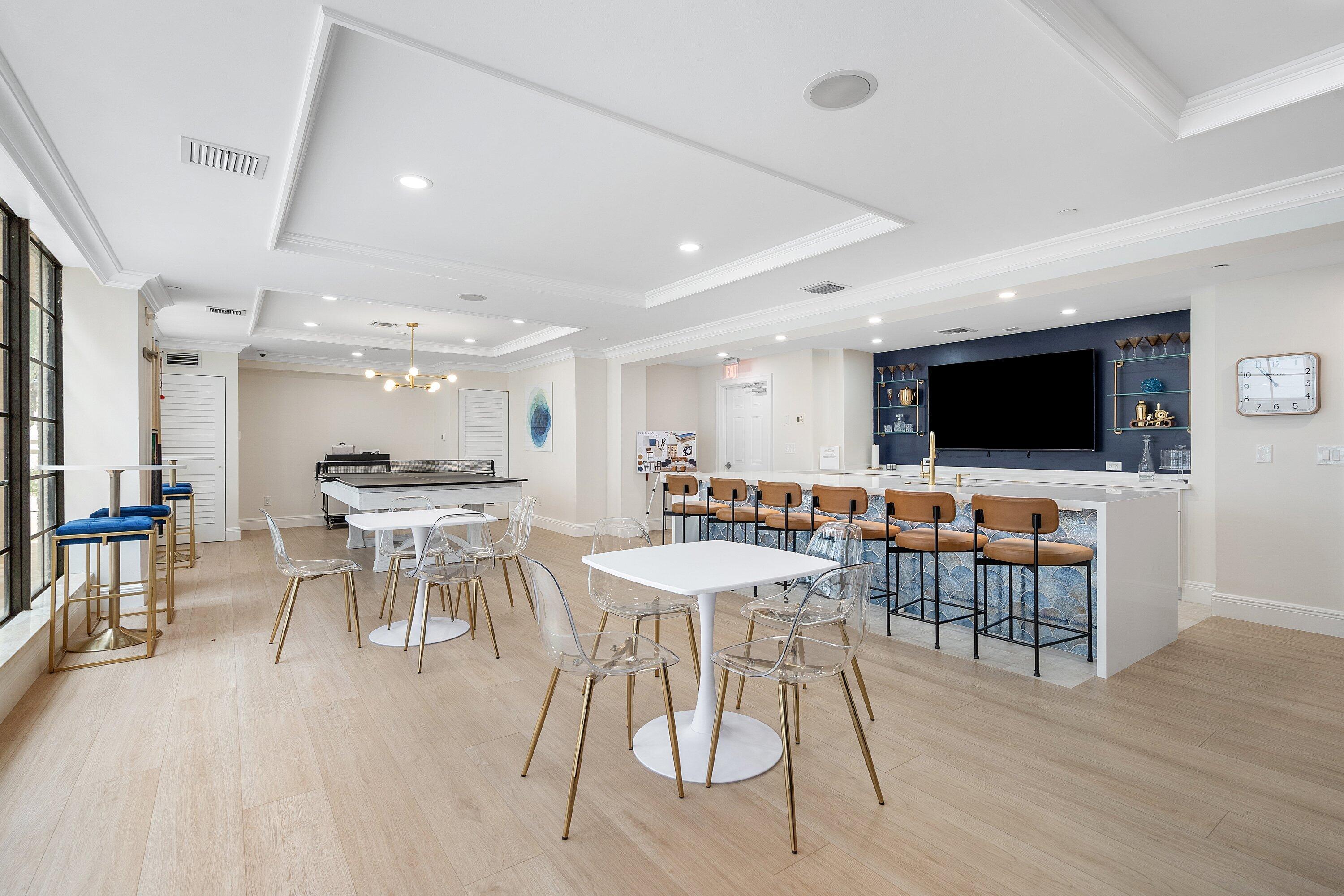 233 South Federal Highway, Unit 308 Boca Raton, FL 33432 - Photo 33 of 44 a view of a dining room with furniture wooden floor and a rug
