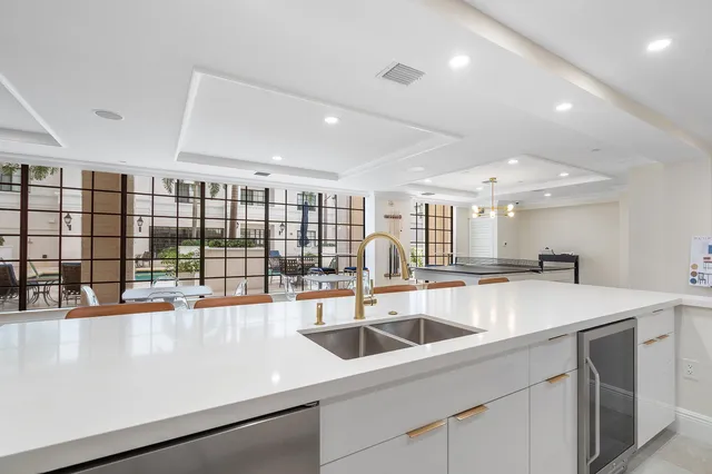 a kitchen with a sink and large window
