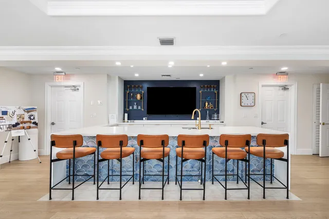 a group of chairs sitting in a kitchen