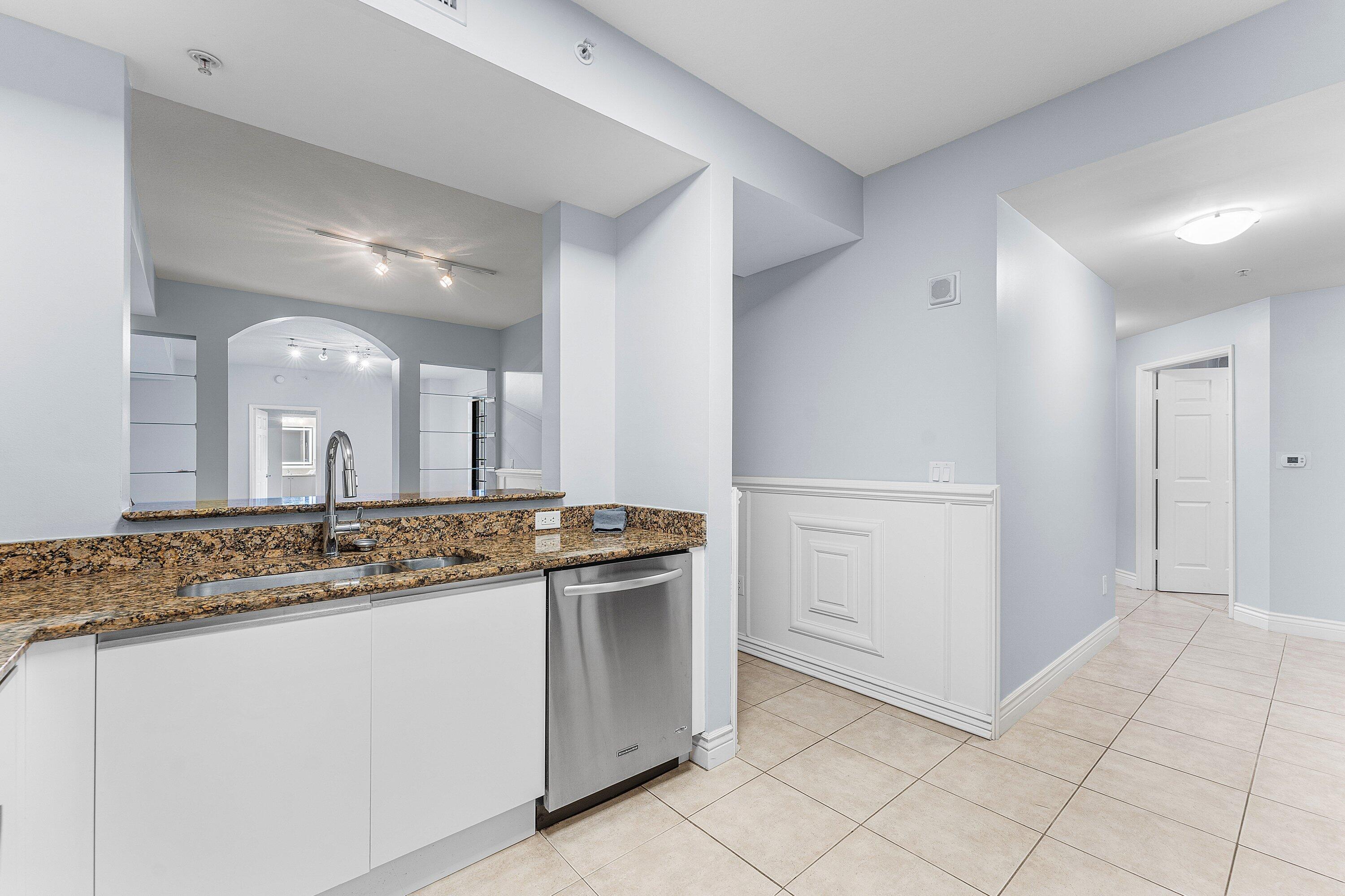 233 South Federal Highway, Unit 308 Boca Raton, FL 33432 - Photo 9 of 44 a bathroom with a granite countertop sink and a mirror