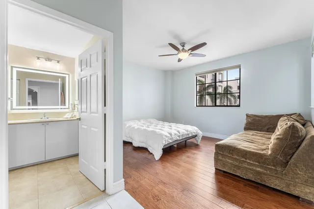 a bedroom with bed and window