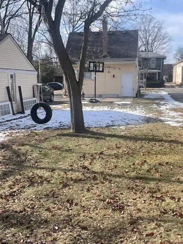 a view of a backyard of a house