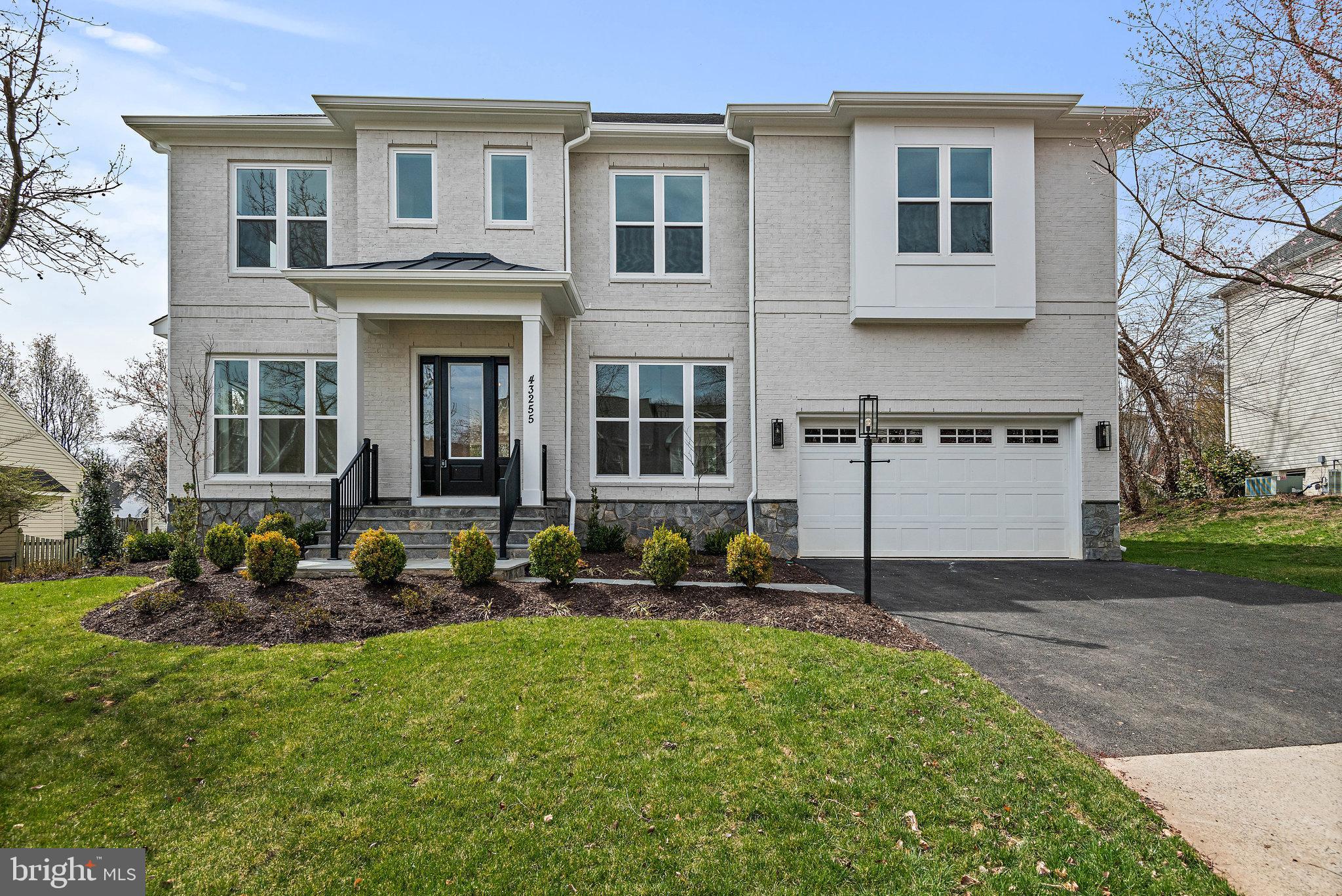 43255 Kimberly Anne Court Ashburn, VA 20147 - Photo 1 of 48 a front view of a house with a yard
