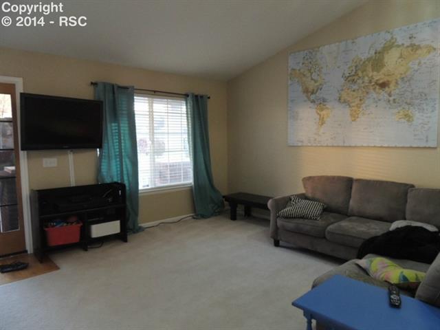 6797 Akron Road Colorado Springs, CO 80923 - Photo 10 of 23 More open spaces... room for snuggles, TV time and play!
