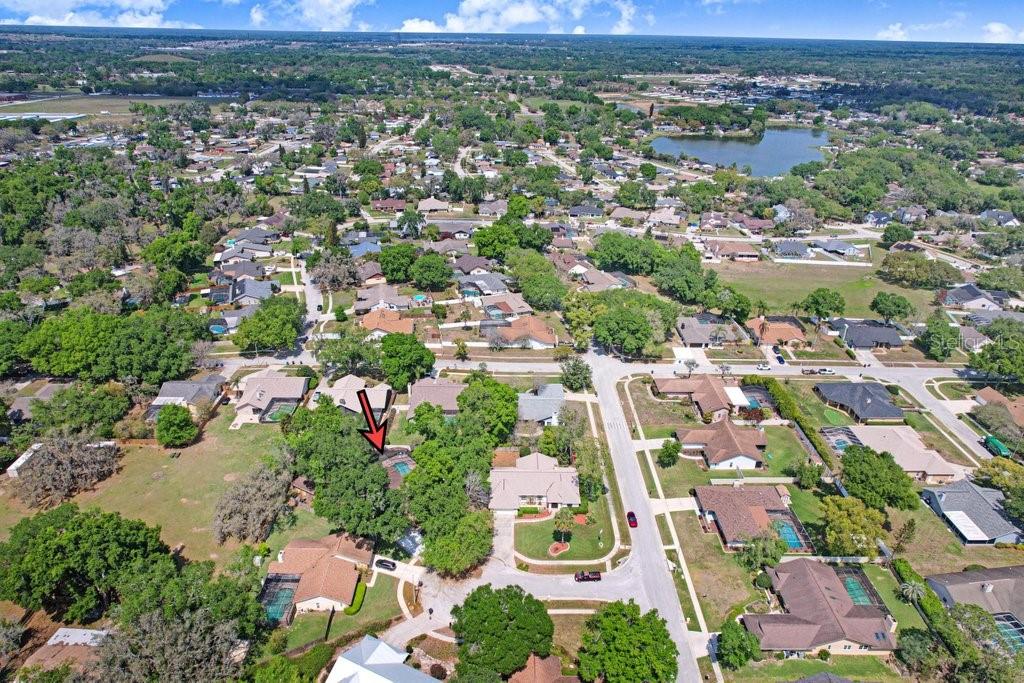 504 Triple Crown Court Seffner, FL 33584 - Photo 11 of 63 an aerial view of residential houses with outdoor space