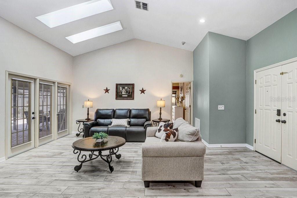 504 Triple Crown Court Seffner, FL 33584 - Photo 17 of 63 a living room with furniture and wooden floor
