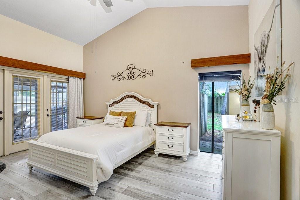 504 Triple Crown Court Seffner, FL 33584 - Photo 19 of 63 a bedroom with a bed and a dresser
