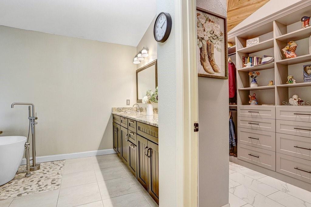 504 Triple Crown Court Seffner, FL 33584 - Photo 23 of 63 a bathroom with a sink and a mirror