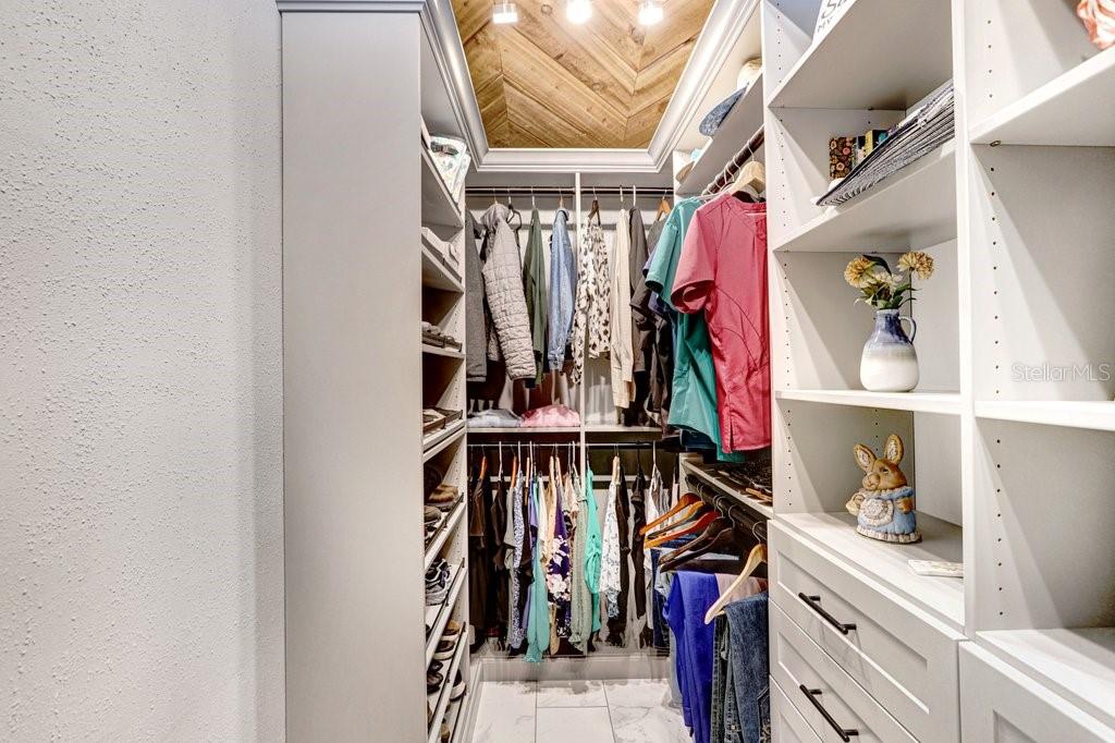 504 Triple Crown Court Seffner, FL 33584 - Photo 26 of 63 a view of walk in closet with clothes