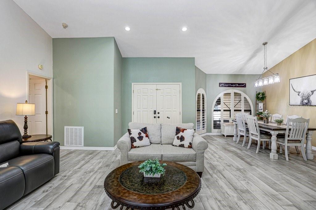 504 Triple Crown Court Seffner, FL 33584 - Photo 29 of 63 a living room with furniture and a dining table