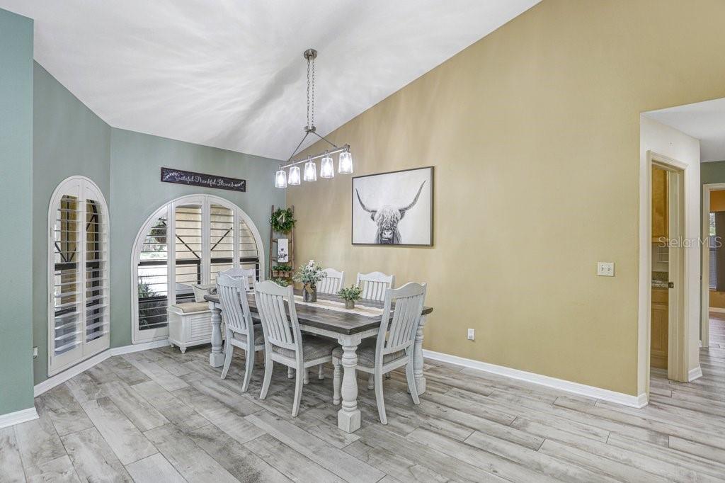 504 Triple Crown Court Seffner, FL 33584 - Photo 30 of 63 a view of a dining room with furniture window and wooden floor