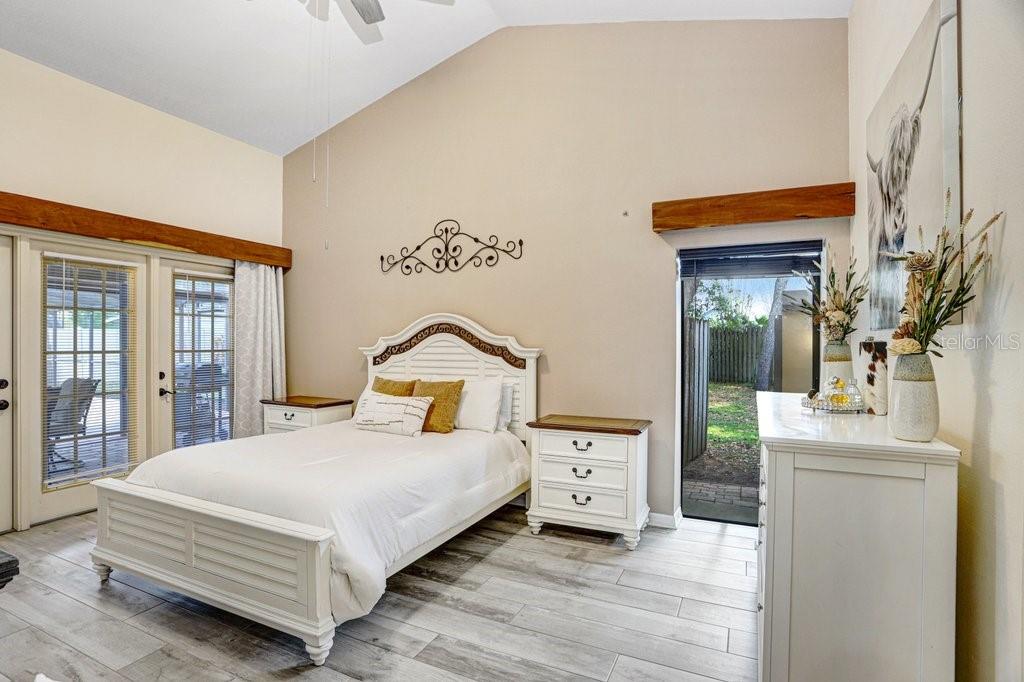 504 Triple Crown Court Seffner, FL 33584 - Photo 3 of 63 a bedroom with a bed and a table