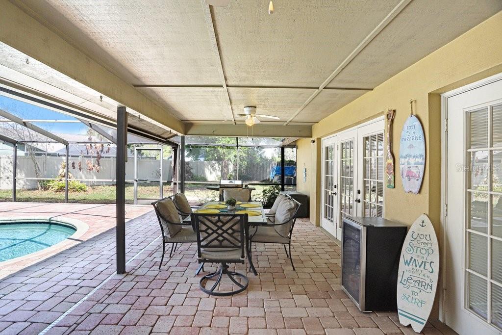 504 Triple Crown Court Seffner, FL 33584 - Photo 38 of 63 a dining room with furniture and large windows