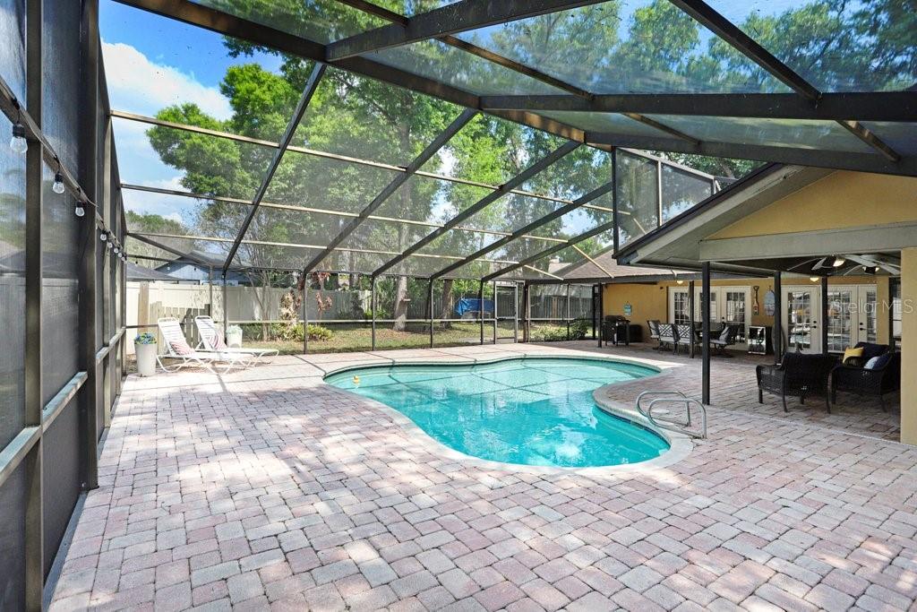 504 Triple Crown Court Seffner, FL 33584 - Photo 41 of 63 a view of a swimming pool with a patio