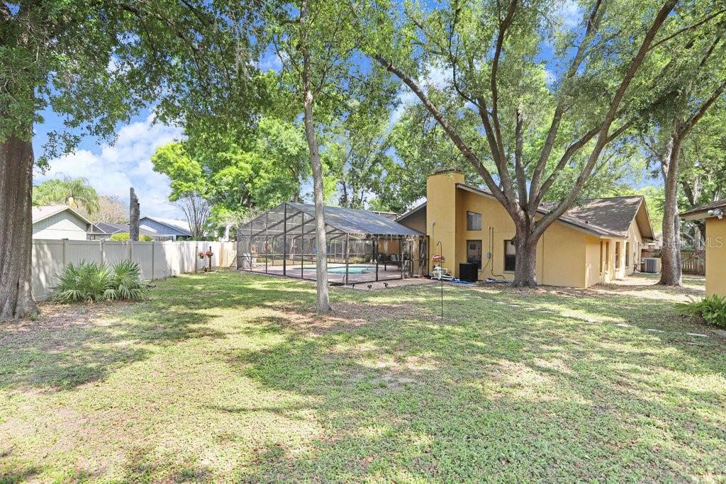 504 Triple Crown Court Seffner, FL 33584 - Photo 44 of 63 a view of a house with a yard